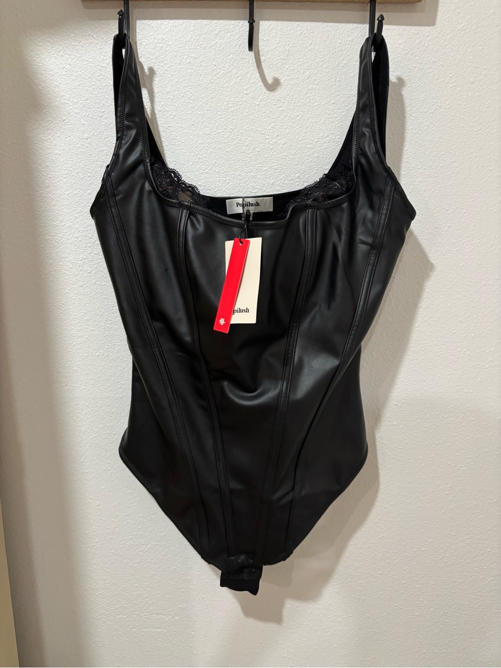 Lush Black Faux-Leather Kids One-Piece Bodysuit with Lace Trim